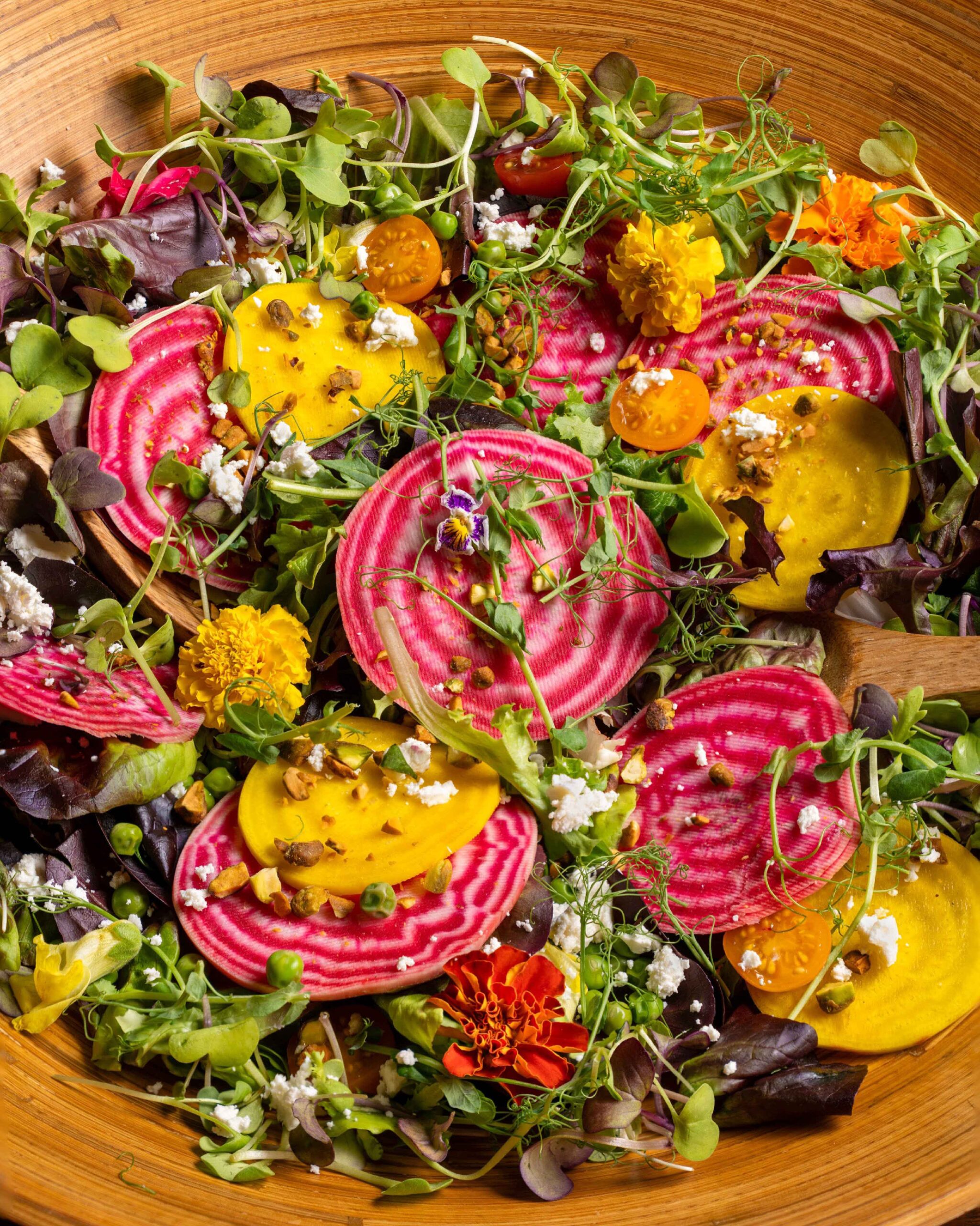 Colorful Chioggia beet salad with golden beets, microgreens, edible flowers, and feta — recipe by Food Color Spice